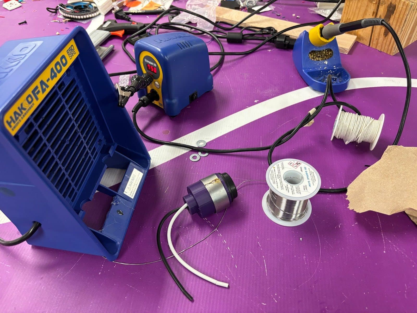 Soldering setup with flux and iron for bonding petals